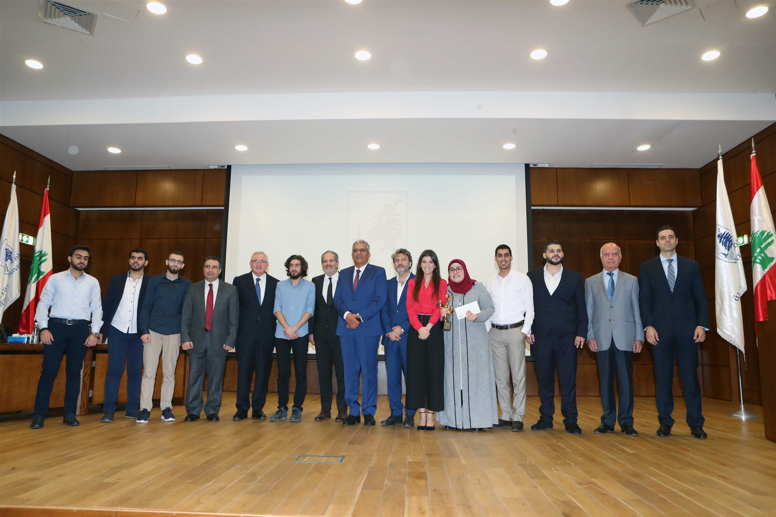 a picture with the members of the jury, honorable guests and mrs. inas al jarmakani.
