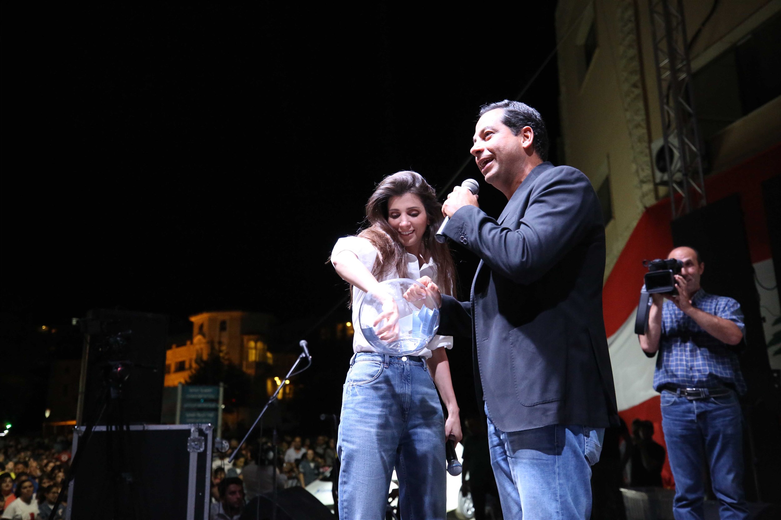 talk show host michel azzi with mrs. inas al jarmakani during one of the many activities that took place at the sandouk el dounia festival.