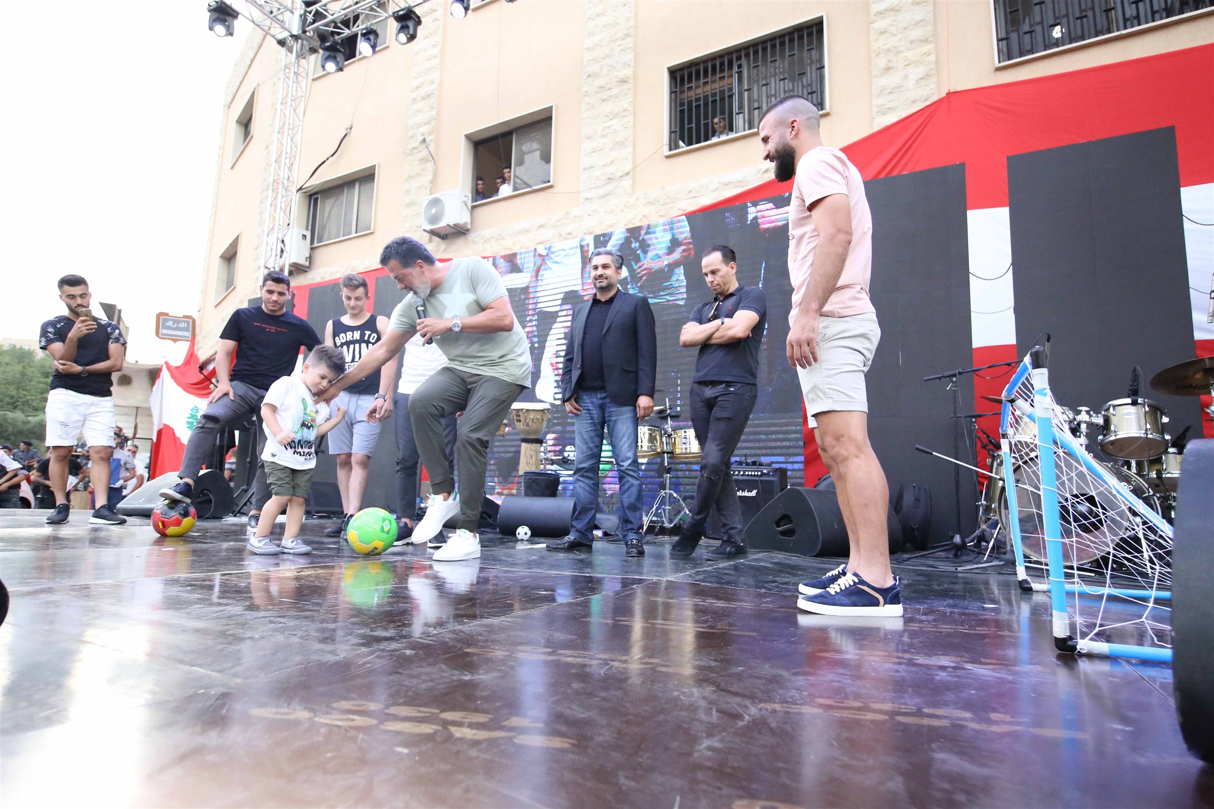 the football team “el nejmeh” and host tony baroud enjoying a friendly game with the audience.